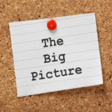 note with words "The Big Picture" tacked to bulletin board