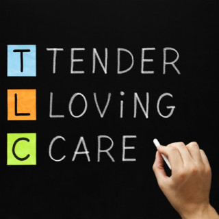 blackboard with the words: "Tender, Loving, Care"