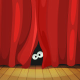 Two eyes peeking out from behind a theater curtain