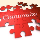 Illustration of a jigsaw puzzle with the word Community in the middle