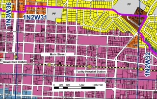 Segment of Hillsboro's comp plan map. Click on image to view it at larger size. The light purple identifies part of the downtown district. The * symbols show the location of the light rail stations.