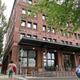 Warehouse converted into mixed-use project, with a restaurant on the ground floor.