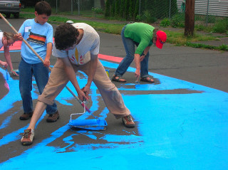 Painting residential intersections brings neighbors together in Portland -- and it's fun for kids.