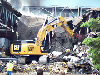 Bulldozers clear debris from destroyed portions of Verso paper mill. photo courtesy City of Sartell.