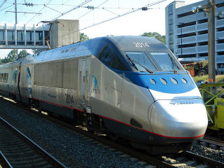 Amtrak Acela train at BWI Airport Station between Baltimore and Washington, DC. Photo by Michael Renner; Flickr Creative Commons license.